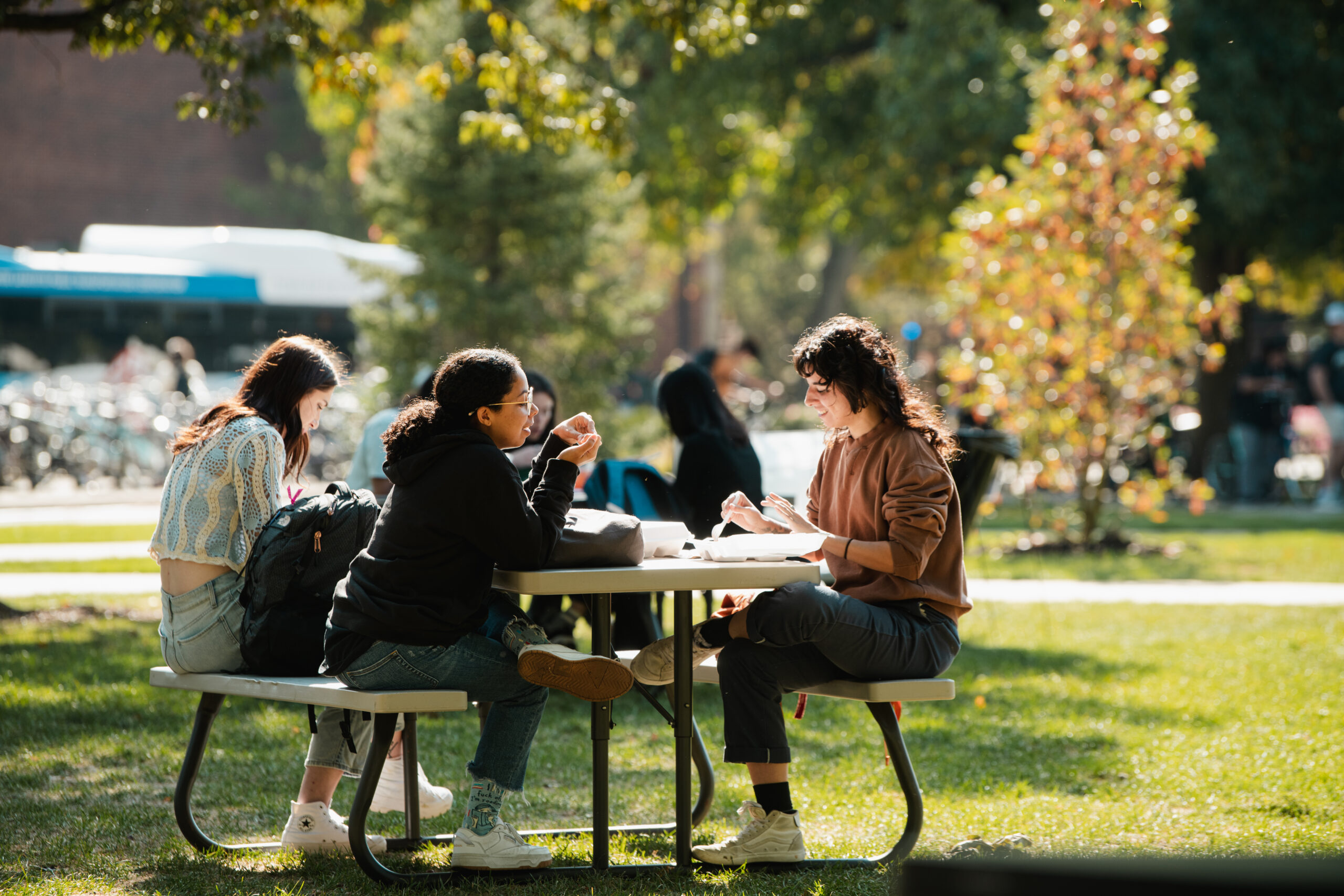 image of students at a picnic table on campus